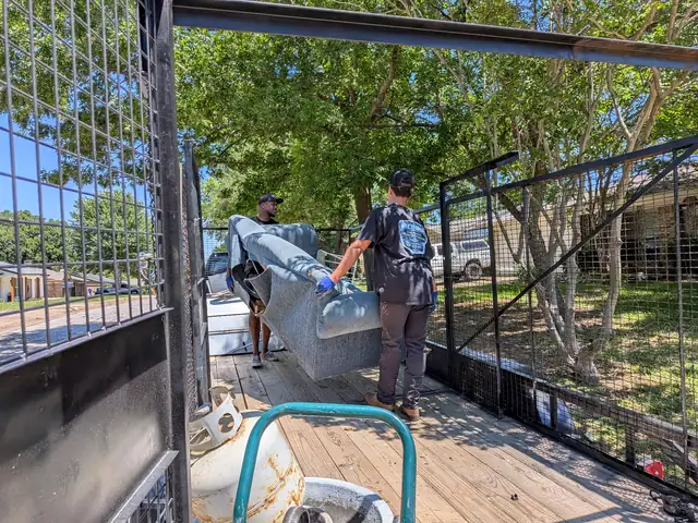 Recourse crew loading furniture onto the trailer