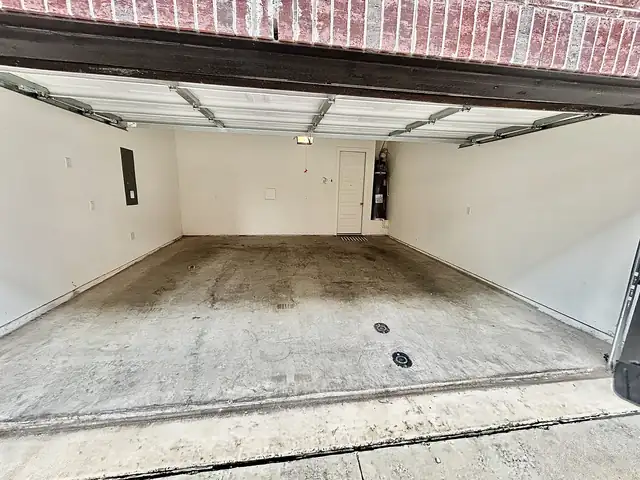 The same two-car garage cleared and empty