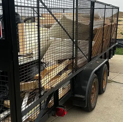 Recourse trailer loaded with junk and debris