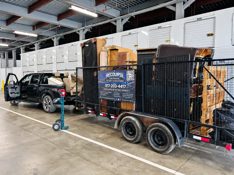 Recourse truck and trailer loaded with furniture inside a storage facility